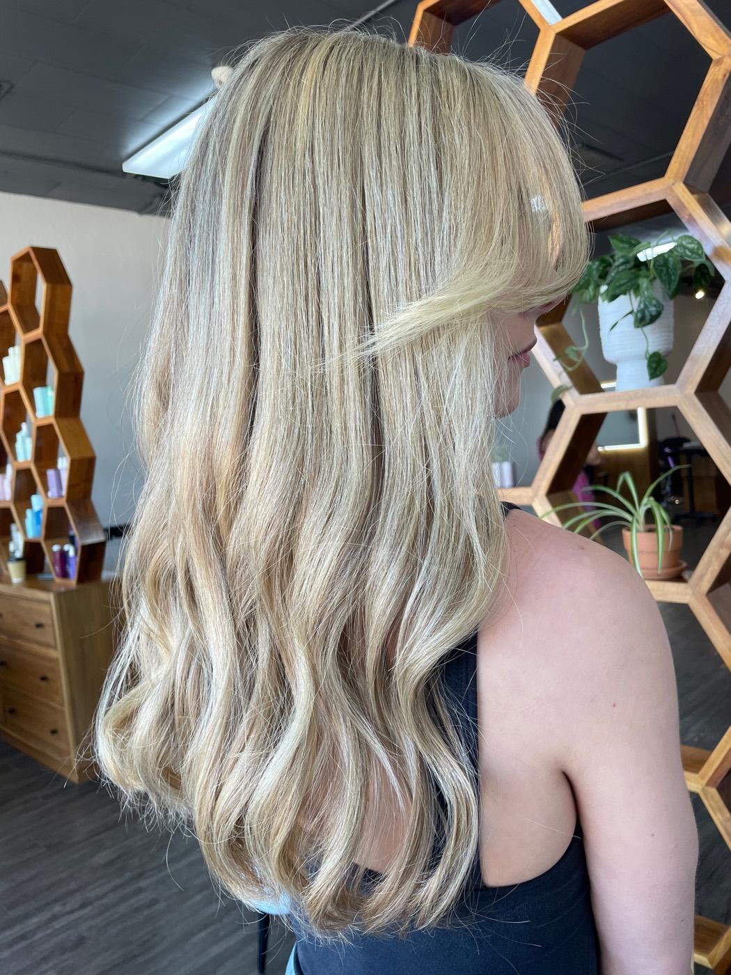 Bright dimensional blonde highlights by Mya Binder in Fort Worth