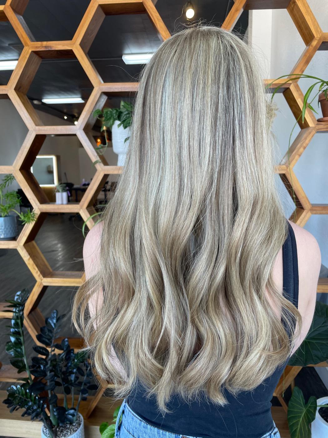Lived-in blonde highlights with beachy waves