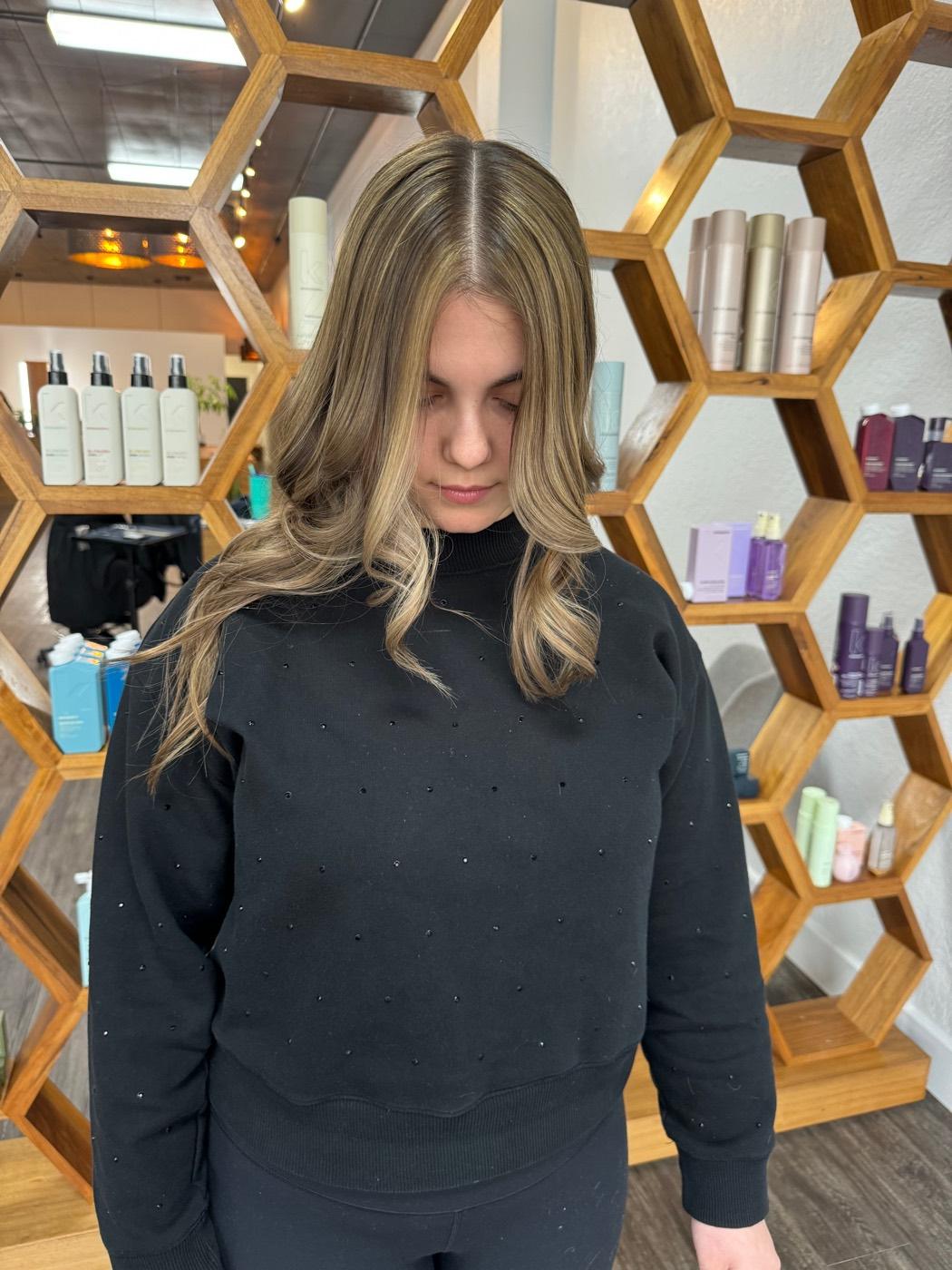 Lived-in blonde balayage with a soft smudged root