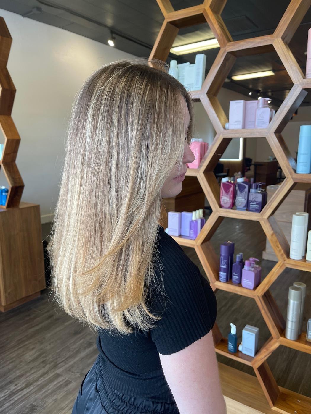 Soft blonde balayage cut into long layers