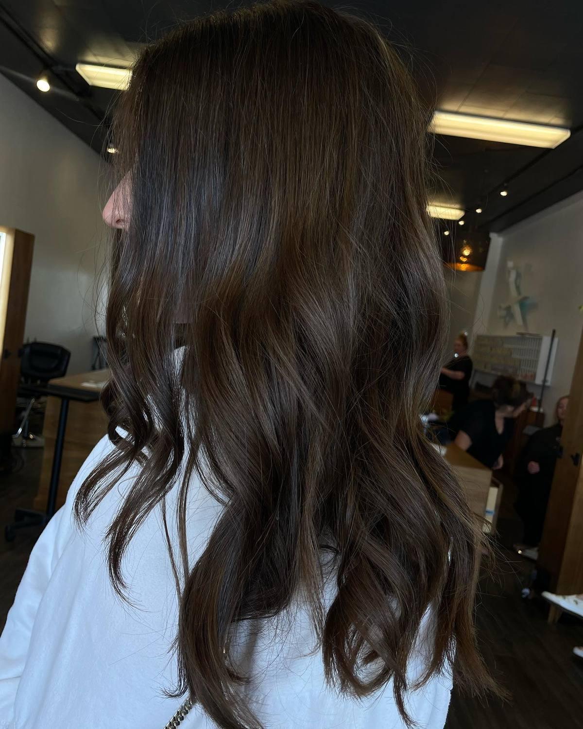 Deep brunette with soft brushed-out waves