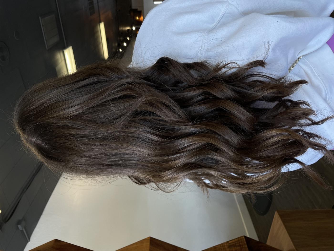 Rich brunette with subtle dimension and beach waves