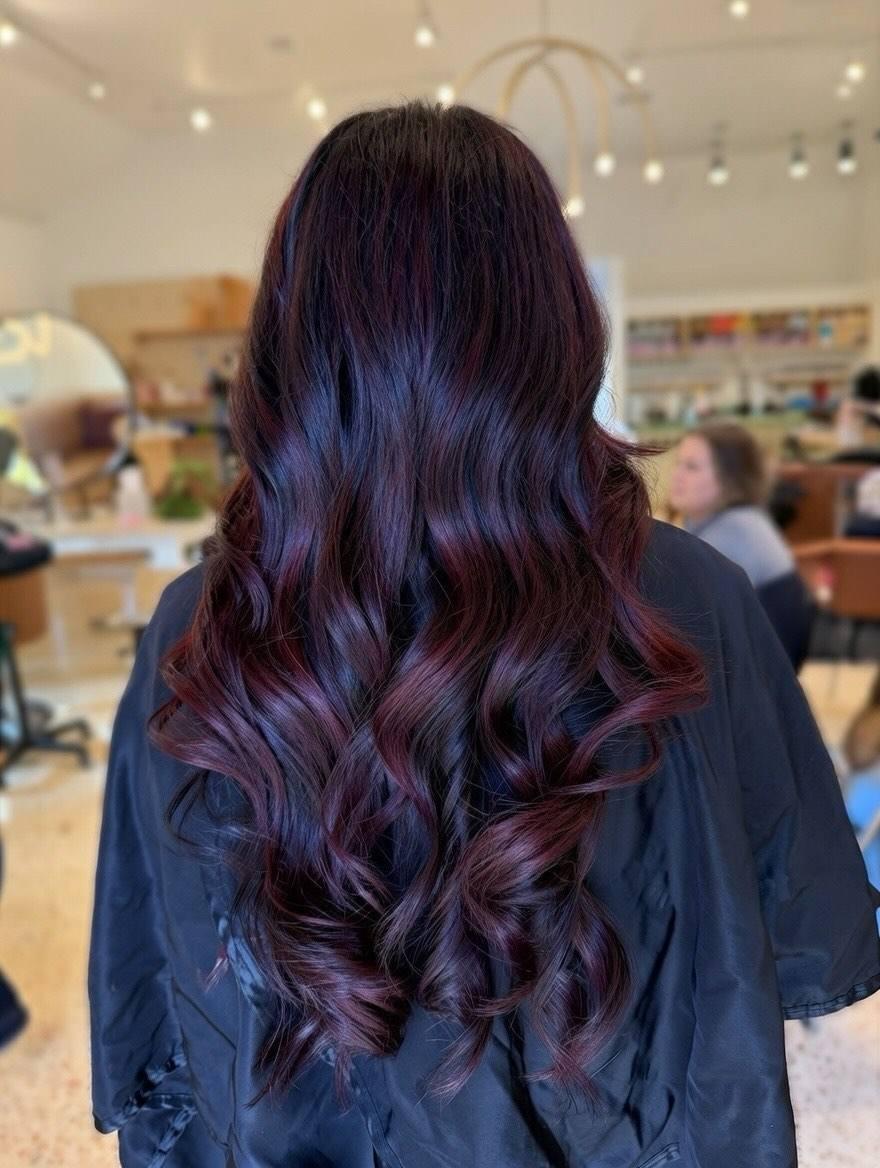 Dark base with plum and burgundy balayage waves